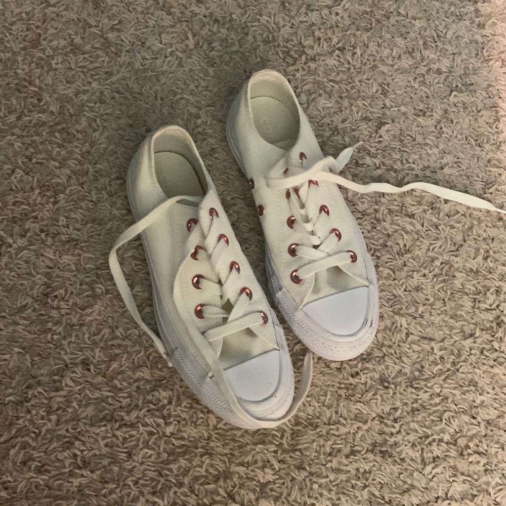 Cream and pink low top Converse sneakers